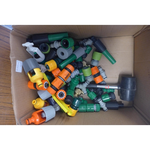 2362 - A box of hose pipe attachments and hose pipe