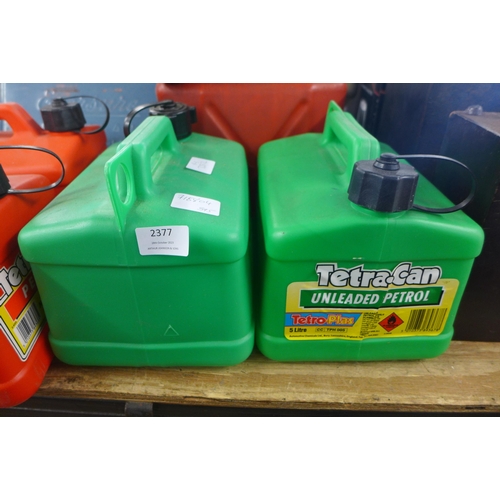 2377 - Seven assorted fuel cans- one metal and two plastic