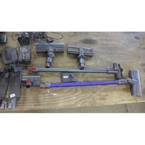 2383 - A large box of Dyson cordless parts including bodies, chargers, docks, wands, cleaning heads - all u... 