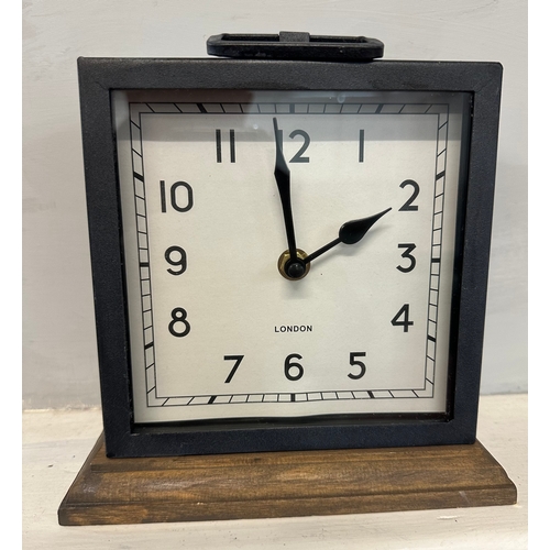 1372D - A square metal clock with wooden base