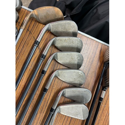 2264 - A Titleist golf bag with a set of Taylor Made Aero Burners graphite shaft irons (6,7,8,9,pw,sw) ping... 