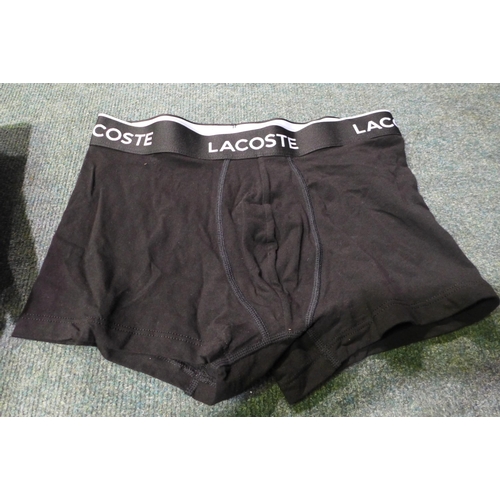 3043 - Assorted men's boxer shorts and a pair of Head gloves. *This lot is subject to VAT