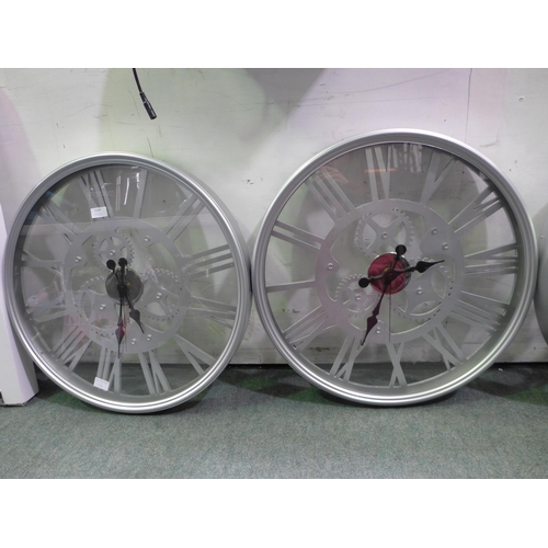 3100 - Two circular cog wall clocks