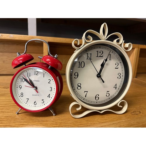 1338A - A Jones small red alarm clock and a small white clock