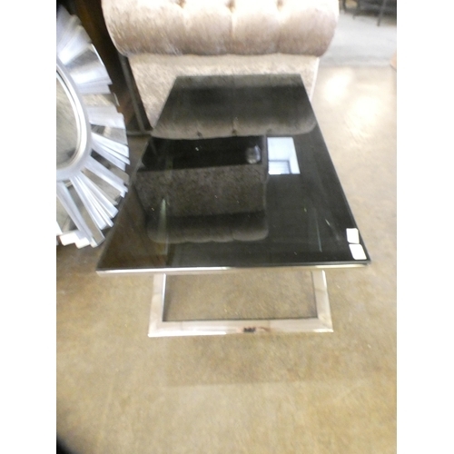 1353 - A black glass and chrome coffee table * this lot is subject to VAT