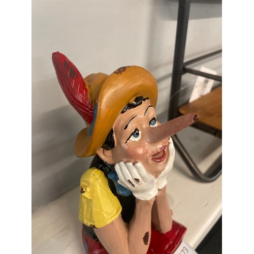 1373 - A sitting Pinocchio figure (RM5410)