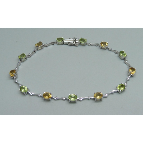 1003 - A 9ct white gold and citrine stone set bracelet, 6.2g, 19cm