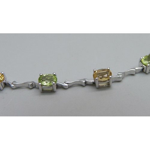 1003 - A 9ct white gold and citrine stone set bracelet, 6.2g, 19cm