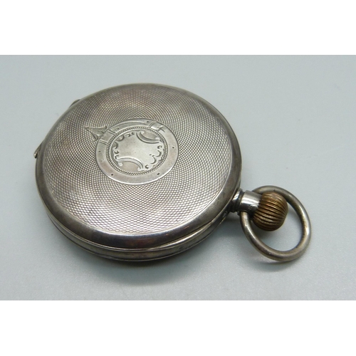 1021 - An engine turned silver cased pocket watch, London import mark for 1910