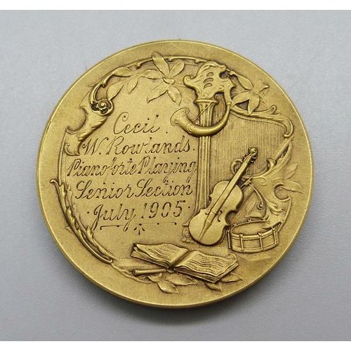 1023 - A 1905 London College of Music bronze medallion, boxed