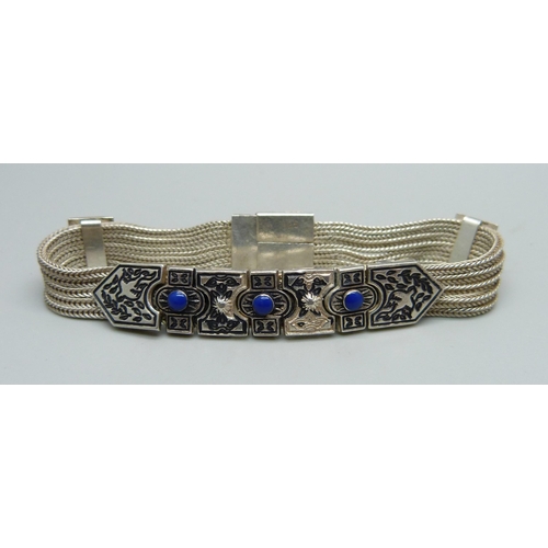 1031 - A 925 silver and blue stone bracelet, 17.5cm