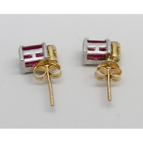 1040 - A pair of 9ct gold, diamond and red stone earrings, 1.4g