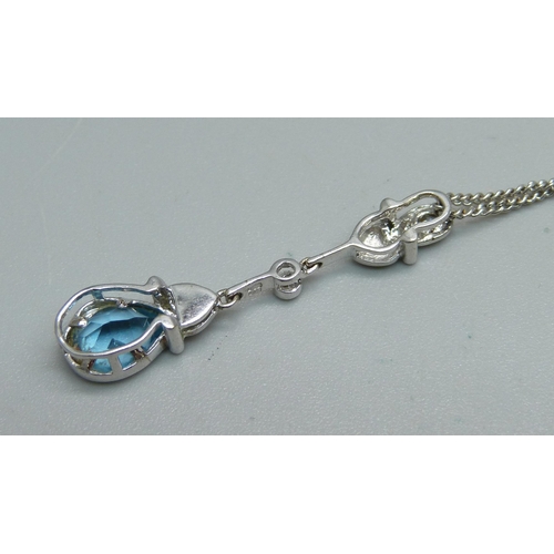 1042 - An 18ct white gold, diamond and topaz pendant on chain, 5g, 46cm