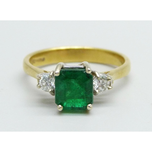 1062 - An 18ct gold and emerald ring with diamond shoulders, emerald approximately 6mm x 6mm, 3.3g, L