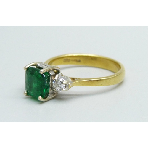 1062 - An 18ct gold and emerald ring with diamond shoulders, emerald approximately 6mm x 6mm, 3.3g, L