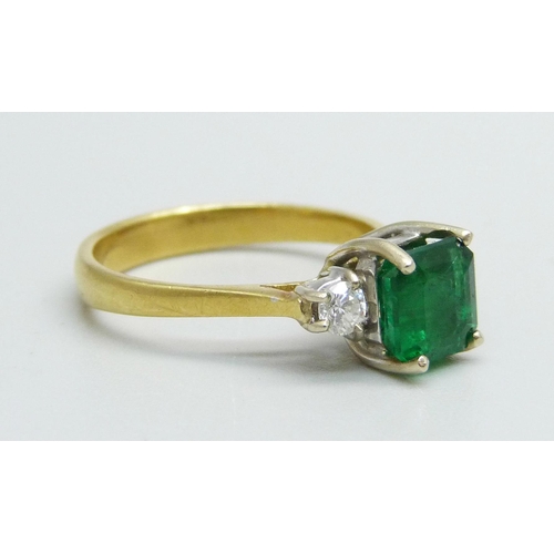 1062 - An 18ct gold and emerald ring with diamond shoulders, emerald approximately 6mm x 6mm, 3.3g, L