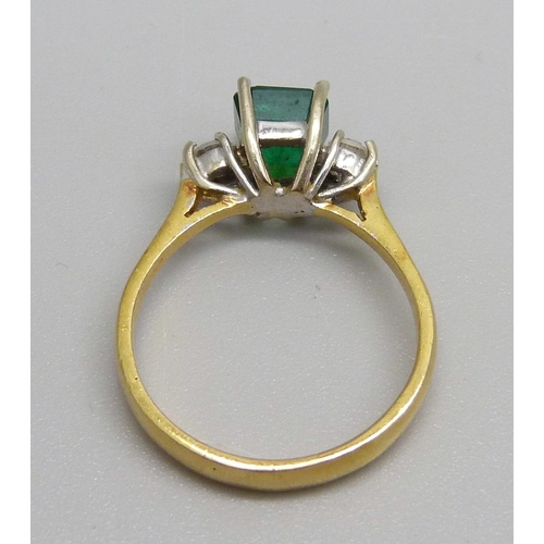 1062 - An 18ct gold and emerald ring with diamond shoulders, emerald approximately 6mm x 6mm, 3.3g, L