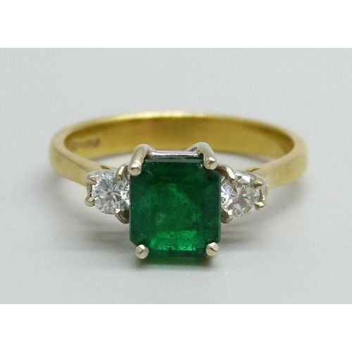 1062 - An 18ct gold and emerald ring with diamond shoulders, emerald approximately 6mm x 6mm, 3.3g, L