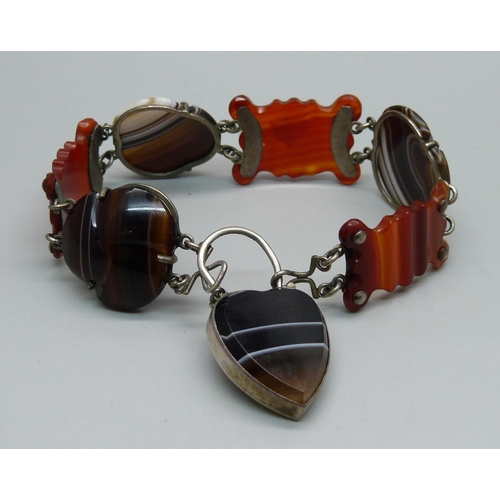 1065 - A Scottish agate set white metal bracelet with padlock clasp