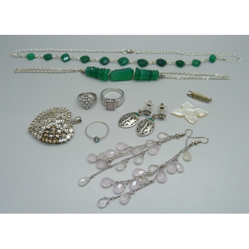 1070 - A collection of silver and white metal jewellery, including two 925 silver rings and large pendant