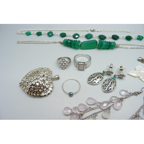 1070 - A collection of silver and white metal jewellery, including two 925 silver rings and large pendant