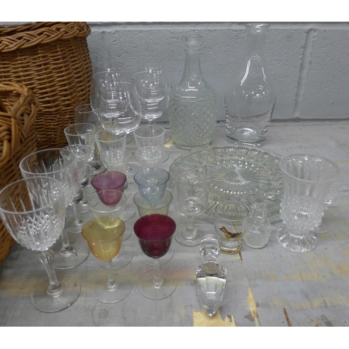 1096 - Two mid 20th Century wicker baskets and a collection of crystal and glass including a modern decante... 