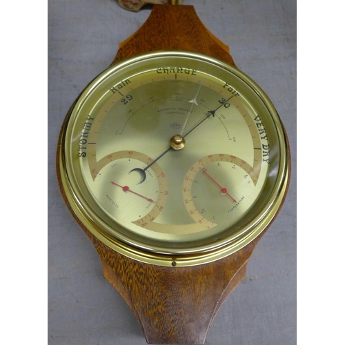 1104 - A barometer, an oil lamp, a figure and a globe **PLEASE NOTE THIS LOT IS NOT ELIGIBLE FOR POSTING AN... 