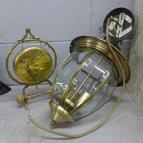 1123 - A brass gong and a ceiling light **PLEASE NOTE THIS LOT IS NOT ELIGIBLE FOR POSTING AND PACKING**