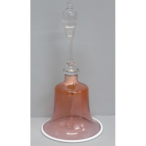 606 - A circa 1900 cranberry glass bell, clacker and internal fitting a/f, 30cm tall