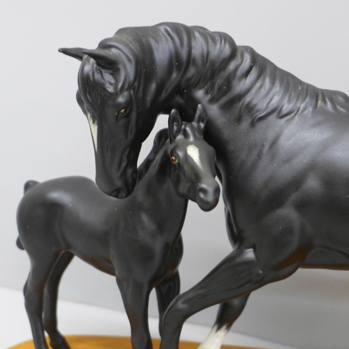 609 - A Beswick figure group, Black Beauty and Foal