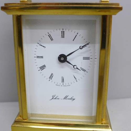 623 - A brass and four glass sided carriage clock with long service inscription, boxed