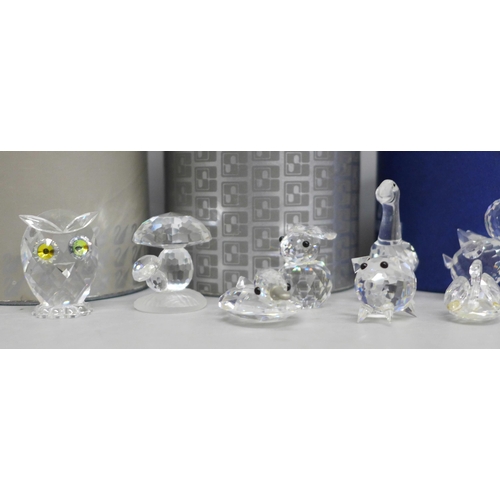 627 - A collection of fourteen Swarovski animals (four boxed)