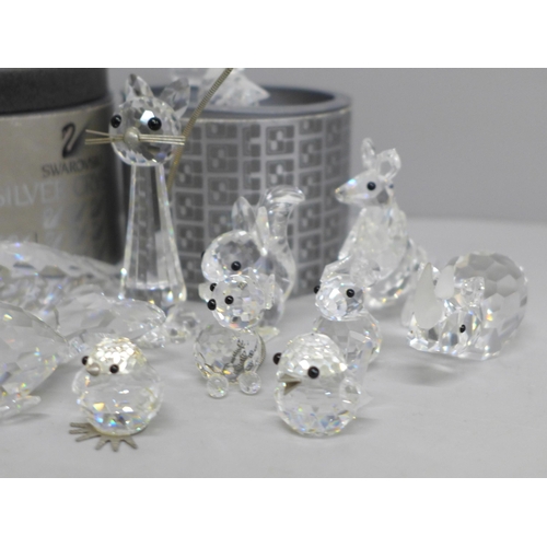 630 - A collection of twelve Swarovski animals including two boxed