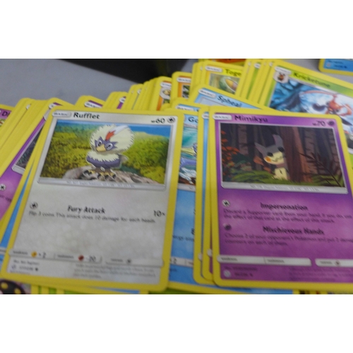 633 - 420 Pokemon cards; 240 Shining Legends and 180 Cosmic Eclipse cards