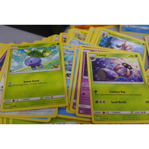 633 - 420 Pokemon cards; 240 Shining Legends and 180 Cosmic Eclipse cards