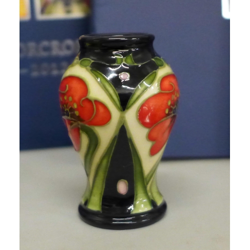 644 - Fourteen Moorcroft Design Collection catalogues, two Moorcroft cards and a miniature vase