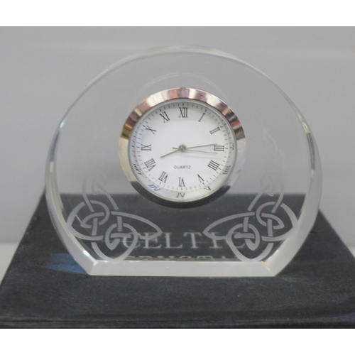 664 - A boxed Celtic crystal clock