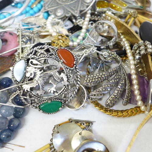 675 - Silver bangles and brooches and other costume jewellery