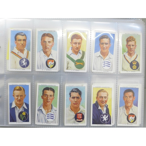 685 - Cigarette cards; an album of Players cigarete cards, ten sets including cricketers, 1930, 1934, 1938... 