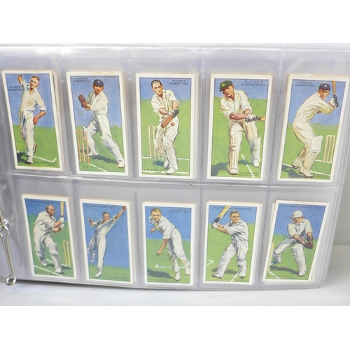 685 - Cigarette cards; an album of Players cigarete cards, ten sets including cricketers, 1930, 1934, 1938... 