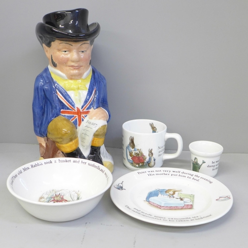 688 - Four pieces of Wedgwood nursery china and a John Bull Toby jug with lid