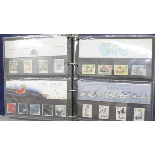 691 - Stamps; an album of GB presentation packs (36)