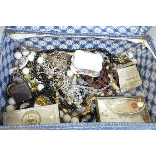 701 - A small suitcase of costume jewellery