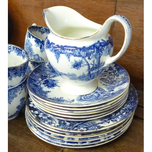 706 - A boxed Royal Pembroke & Edwards tea cup, saucer and cake plate and an English blue and white tea se... 