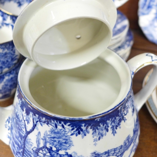 706 - A boxed Royal Pembroke & Edwards tea cup, saucer and cake plate and an English blue and white tea se... 