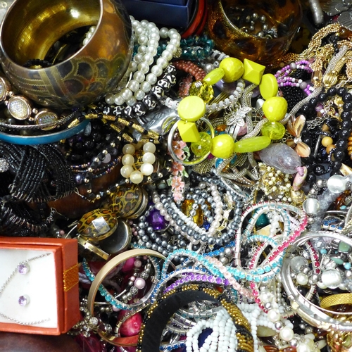 715 - A large box of costume jewellery