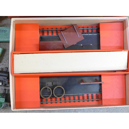 737 - A box of 00 gauge Tri-ang Railways including three tank engines, rolling stock, track, signal box, o... 