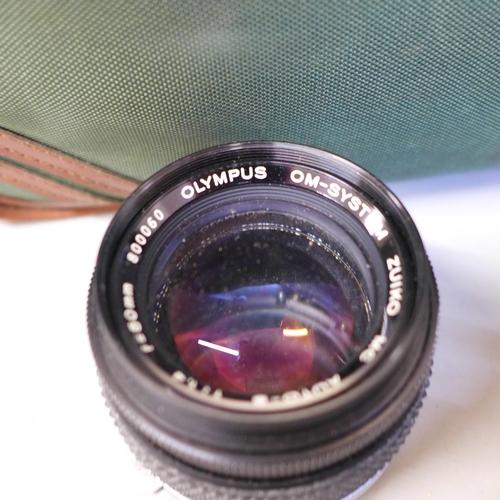 757 - Two cameras; Olympus OM-25 program with Olympus 28mm f=2.8 lens, also with 135mm f=3.5 lens, 50mm 1.... 