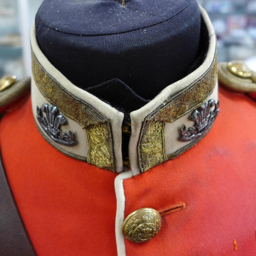 778 - A Welsh Regiment tunic, circa 1880s, lieutenant rank, motto Better Death Than Dishonour, on a manneq... 