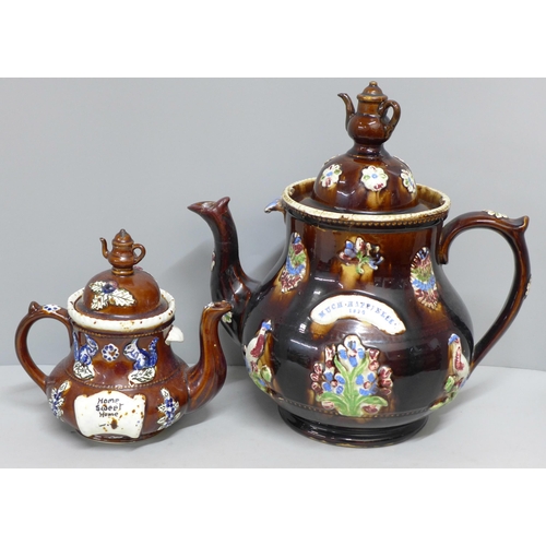 785 - A large bargeware teapot, spout restored and internal crack, one smaller teapot, largest dated 1908